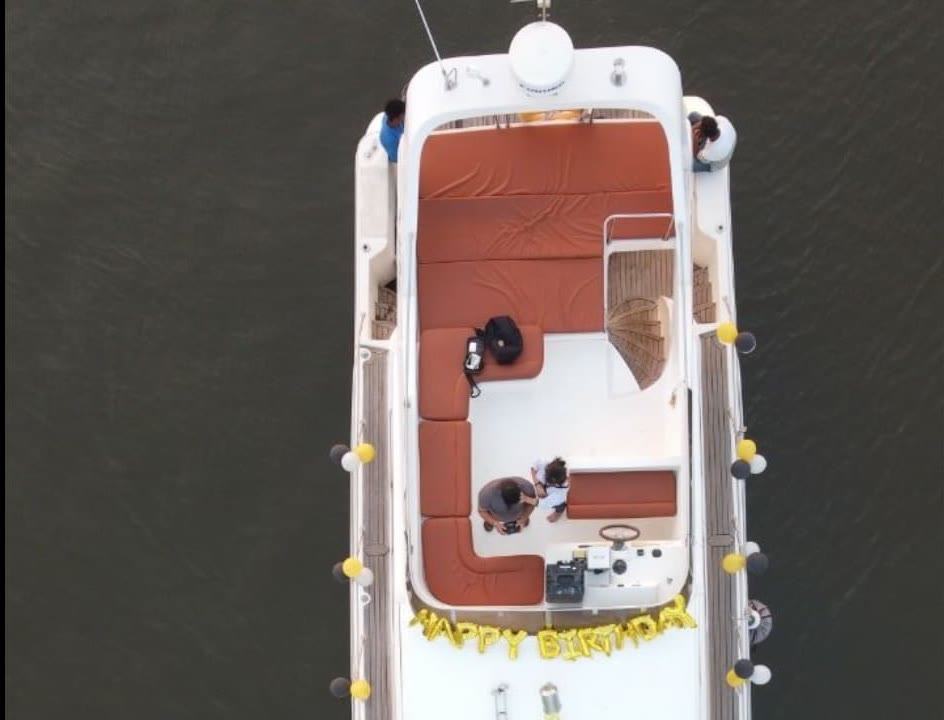 Rooftop deck of the Ambassador dressed with a golden Happy Birthday balloon garland, seen from above