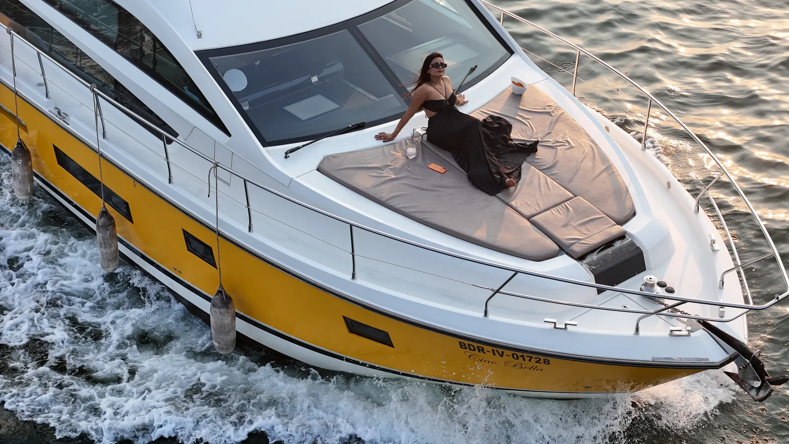 Aerial view of the Ciao Bella yacht's open decks and flydeck, Goa
